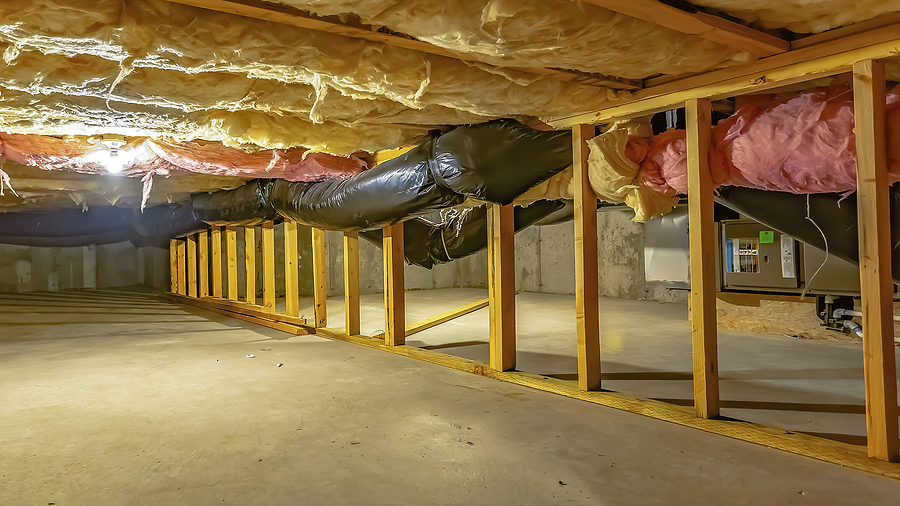 panorama basement or crawl space with upper floor insulation and wooden support beams
